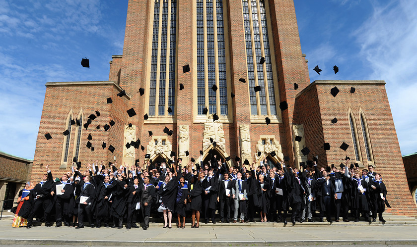 Image University-Student-Graduation-Throwing-Caps-Outside-Large-Standing-Group-Photograph  by Visual Pixel Ltd